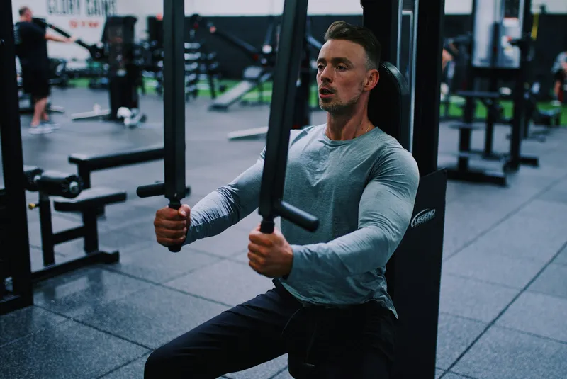 Athlete performing leg strengthening exercise in a gym