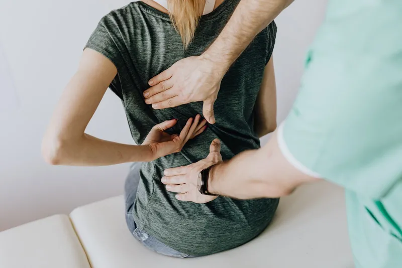 Physical therapist performing a hands-on orthopedic assessment